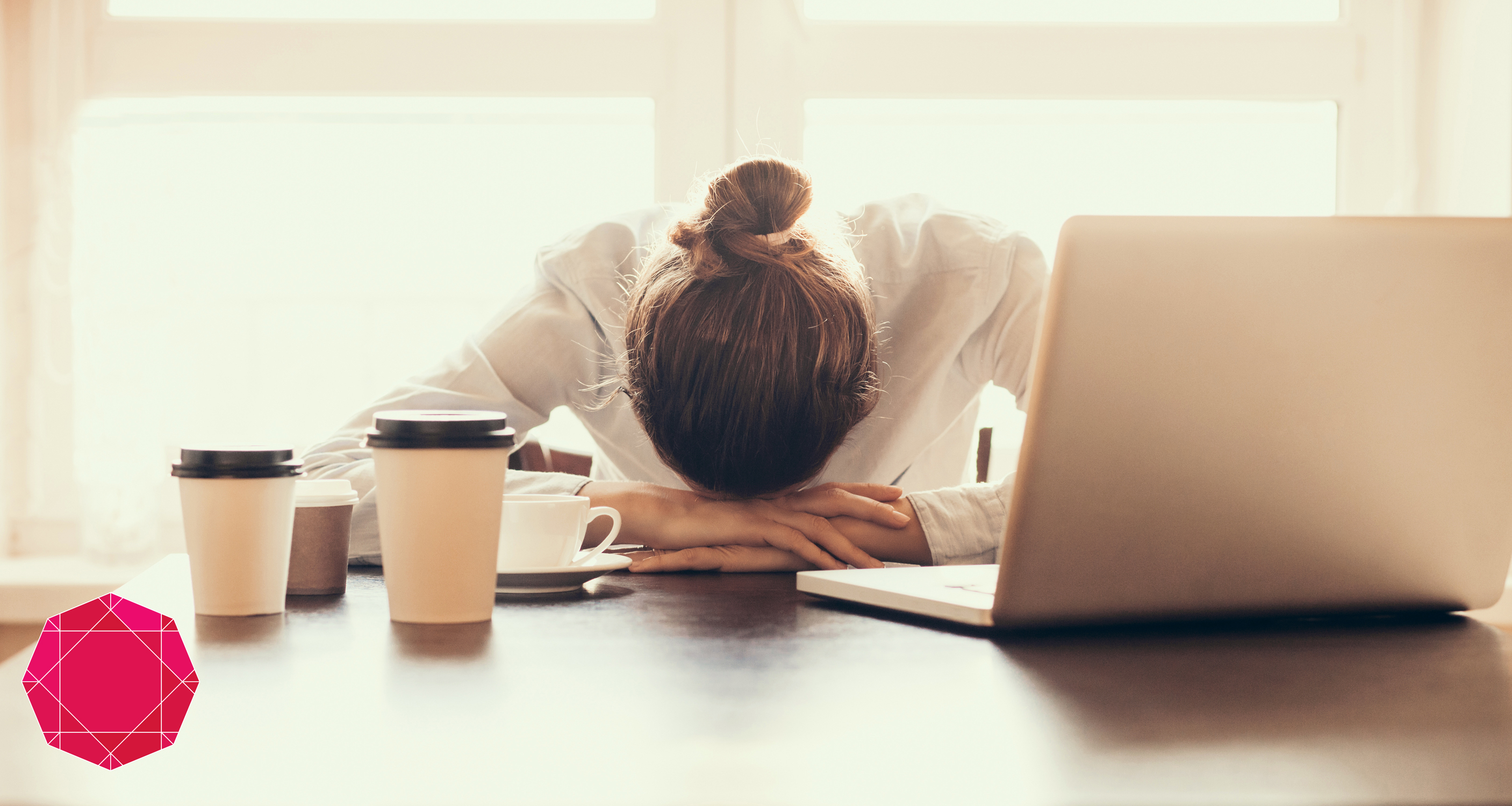 tired girl laying her forehead on her desk